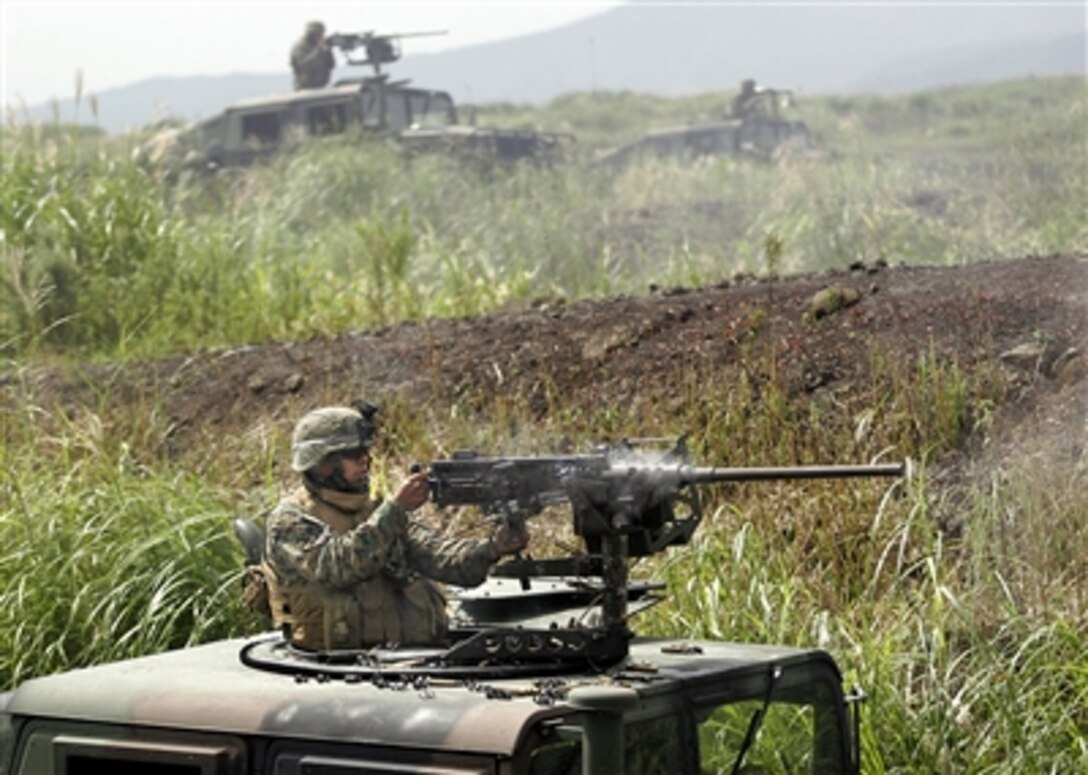 Cpl. Alex Lopez, Weapons Company, 1st Battalion, 5th Marines, 31st Marine Expeditionary Unit’s Battalion Landing Team, provides suppressive fire from an M2 .50-caliber heavy machine gun during a live-fire exercise at the Combined Arms Training Center, Camp Fuji, Japan, Aug. 31, 2006.  