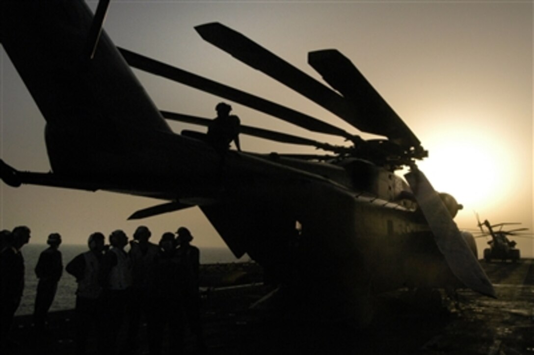 Navy sailors with Helicopter Mine Countermeasures Squadron 14 perform preflight checks on an MH-53E Sea Dragon onboard the amphibious assault ship USS Wasp, Sept. 2, 2006, during an under way period in the Mediterranean Sea in support of Joint Task Force Lebanon. 