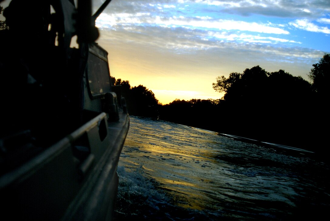 MARINE CORPS BASE CAMP LEJEUNE, N.C. - The 60 sailors participating in the Riverine Coxswain's and Boat Captain's Course continue their four hour trip along the Cape Fear River near sunset Sept. 6. Sixty sailors from various active duty units participated in the final exercise conducted by the Marines with Special Missions Training Center here Sept. 6-14 in preparation for the Navy's take over of Marine Corps river operations in Iraq next year. (Official U.S. Marine Corps photo by Lance Cpl. Brandon R. Holgersen)(released)