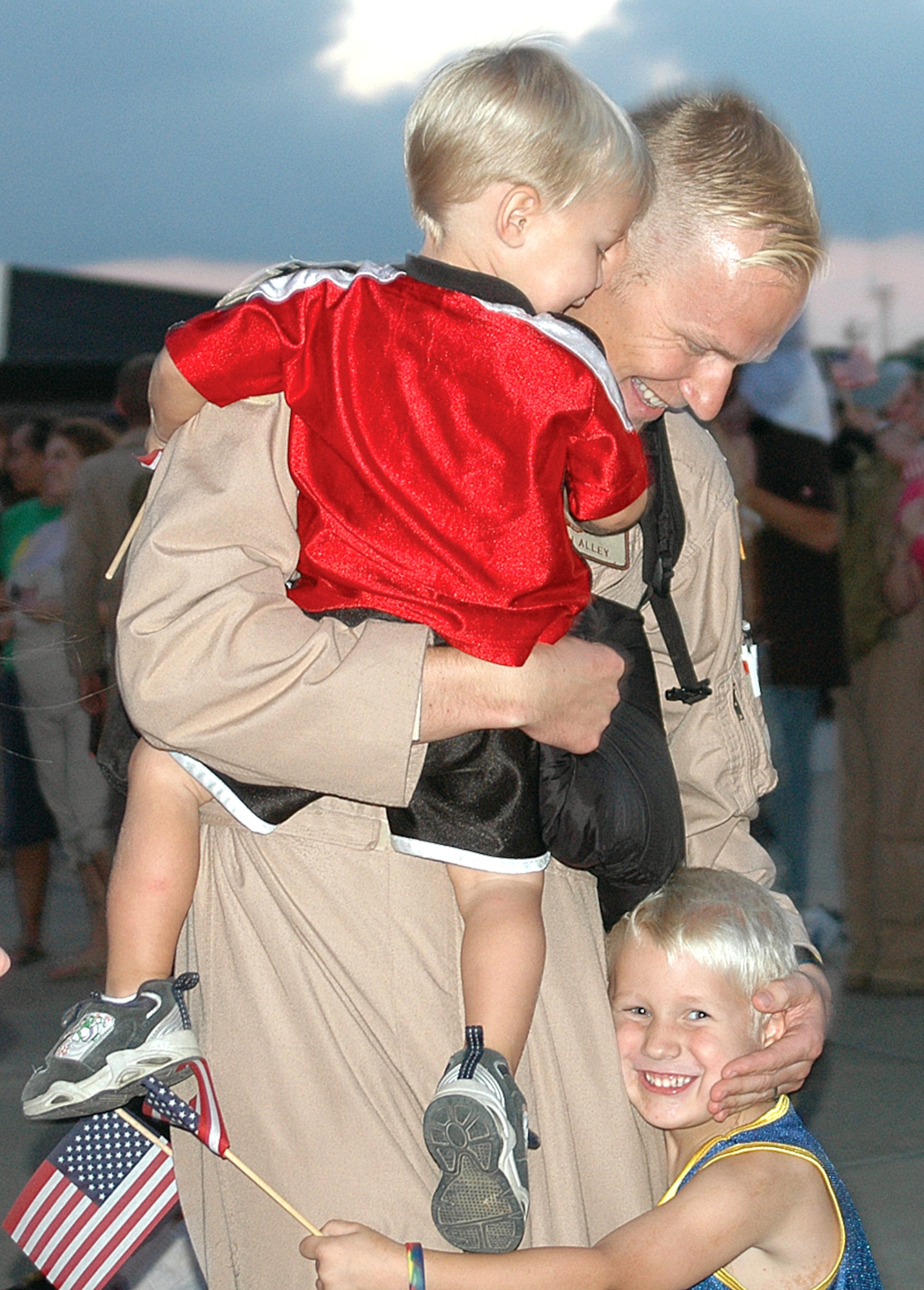 Capt. Mitch Alley reunites with his sons, Brett, 2, and Seth, 5, after returning to Charleston Air Force Base, S.C., Sept. 3 from a deployment. Captain Alley is a pilot with the 17th Airlift Squadron. (U.S. Air Force photo/Airman 1st Class Sam Hymas) 