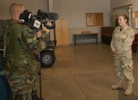 MINOT AIR FORCE BASE, N.D.D -- Senior Airman Jenny Hehnen, 91st Security Forces Group, is interviewed by the base multimedia office Aug. 31. Airman Hehnen is one of 30 members from Minot Air Force Base deploying for 365 days today in support of the Global War on Terror. They will be joining Airmen from other bases to form a larger security unit where they will be training in Air Force SF tactics, followed by additional training from the U.S. Army. The Airmen will work directly with the U.S. Army for the duration of their deployment. (U.S. Air Force photo by Airman Sharida Bishop)                              