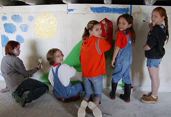 Members of the Animal House 4-H club, a group started by U.S. Air Force reservist Master Sgt. Nancy Immormino, show off their creative talents as they paint their meeting house.  Sergeant Immormino, Chief, 419th MPF Career Enhancements, is an avid volunteer in the community and has recently been recognized as Mentor of the Year by the Youth and Families with Promise organization. (u.s. Air Force Photo/Master Sgt. Nancy Immormino)