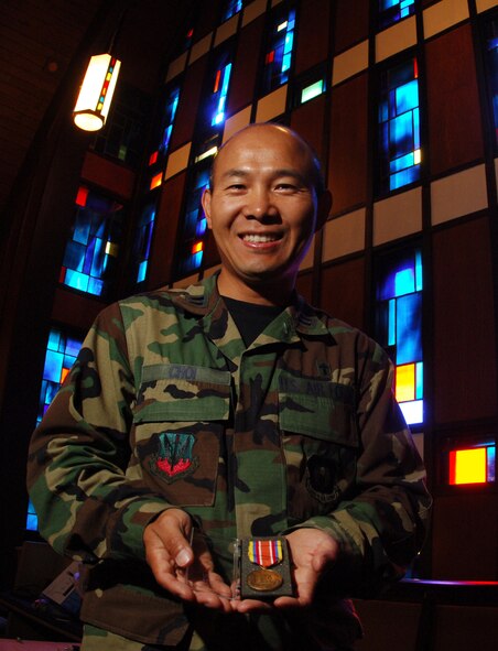 MINOT AIR FORCE BASE, N.D -- Chaplain (Capt.) Jin Choi, 5th Bomb Wing chaplain, displays a Defense of Liberty medal issued by the New York State National Guard Bureau he received for his efforts at ground zero after the Sept. 11, 2001 attacks. (U.S. Air Force photo by Staff Sgt. Joe Laws)