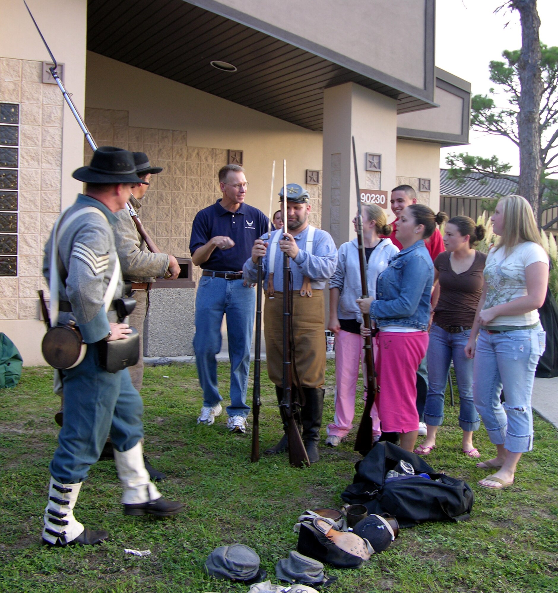 Civil War re-enactors show Airmen weapons from the period. The show-and-tell was part of the third Airman’s Night Out, held Aug. 30 at the base theater. (U.S. Air Force Photograph by Jamie Haig)

