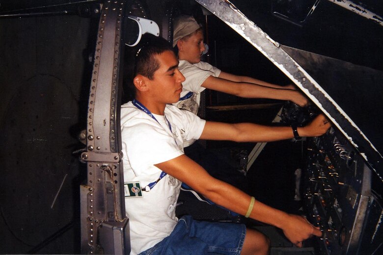 Ben Chastain (left) sits in the flight commander seat during a one-hour training mission in the shuttle orbiter simulator at the week-long Space Academy at Huntsville, Ala. He was one of two Hurlburt youths selected for the camp. (Courtesy Photograph)

