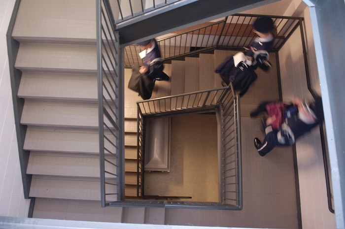 Charleston Air Force Base Honor Guard members walk down a staircase as they head out to a funeral at the base Aug. 29. Honor Guard members are volunteers from units throughout the base and conduct drill and ceremonial duties on and off base for military related functions. (U.S. Air Force photo/Senior Airman Desiree N. Palacios)