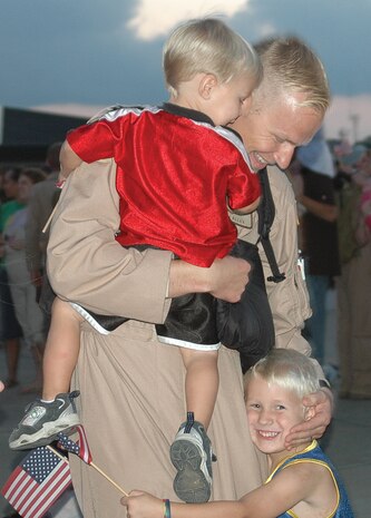 Capt. Mitch Alley, 17th Airlift Squadron pilot, Charleston AFB, SC, reunites with his sons, Brett, 2, and Seth, 5, after returning from a three-month deployment Sept. 3.  The 14 AS replaced the 17 AS downrange. (U.S. Air Force photo/Airman 1st Class Sam Hymas) 