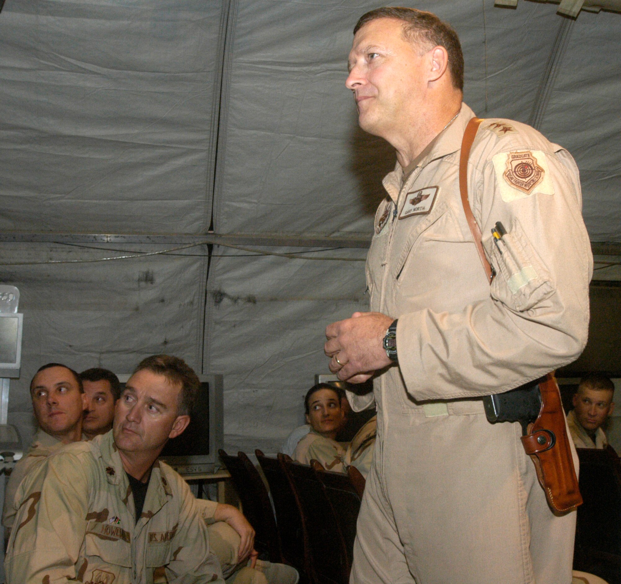 Lt. Gen. Gary North, commander of Central Command Air Forces, listens to a question from an Airman deployed to Bagram Airfield, Afghanistan, during an Airman's call at the base Sept. 7.  General North told Airmen at Bagram that the base is vital to the war against terrorism and that 120-day air expeditionary force rotations will remain the standard for most career fields in the Air Force.  (U.S. Air Force photo/Maj. David Kurle)