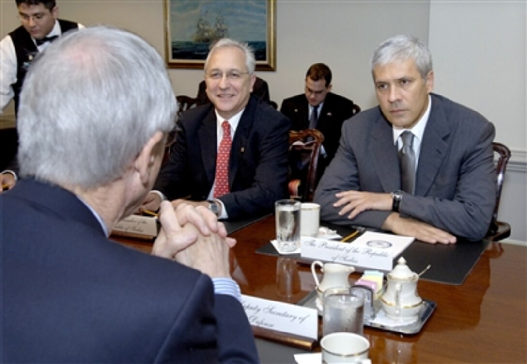 Serbian President Boris Tadic (right) meets with Deputy Secretary of Defense Gordon England (foreground) in the Pentagon on Sept. 8, 2006, to discuss a broad range of bilateral security issues.  Also participating in the meeting is Serbian Ambassador to the United States Ivan Vujacic (center).  
