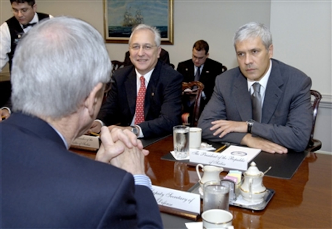 Serbian President Boris Tadic (right) meets with Deputy Secretary of Defense Gordon England (foreground) in the Pentagon on Sept. 8, 2006, to discuss a broad range of bilateral security issues.  Also participating in the meeting is Serbian Ambassador to the United States Ivan Vujacic (center).  