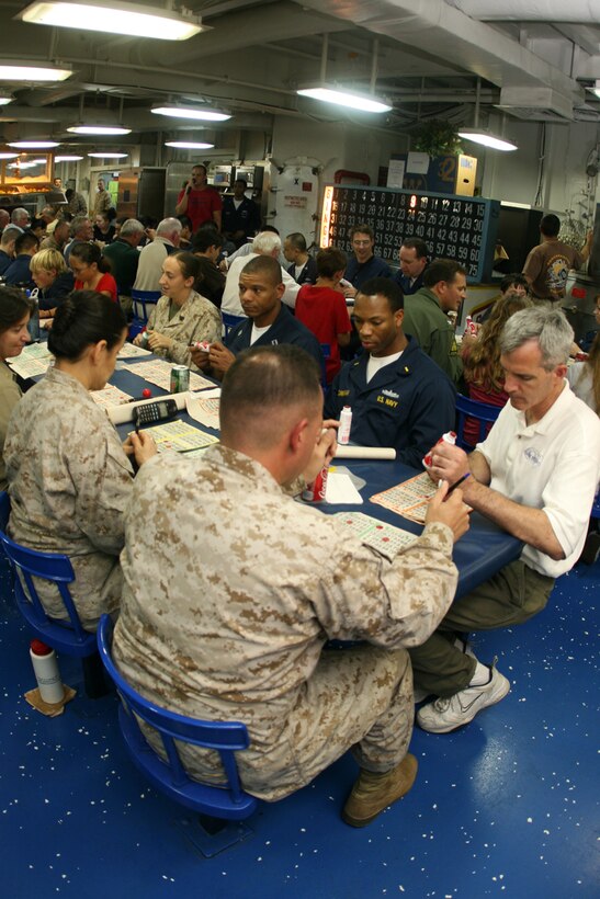 ABOARD USS PELELIU (LHA 5) (Oct. 30, 2008) -- Sailors with the USS Peleliu (LHA 5), Marines with the 15th Marine Expeditionary Unit and "Tigers" play bingo in the mess decks aboard USS Peleliu (LHA 5).::r::::n::   Operation Tiger Cruise is a program which brings civilian friends and family of deployed Marines and Sailors for the final leg of a deployment from Pearl Harbor, Hawaii to San Diego, Calif. aboard U.S. Navy vessels.::r::::n::   During Tiger Cruise, Tigers see the day-to-day operations their service members experience during deployment, including eating in the mess decks and sleeping in troop berthing. ::r::::n::    The Camp Pendleton, Calif. based 15th MEU is comprised of approximately 2,200 Marines and Sailors and is a forward deployed force of readiness capable of conducting numerous operations, such as Non-Combatant Evacuation Operations, Humanitarian Assistance Operations and a wide range of amphibious missions. ::r::::n::   The 15th MEU is currently on the final leg of deployment. (Official USMC photo by Cpl. Timothy T. Parish) (Released)::r::::n::