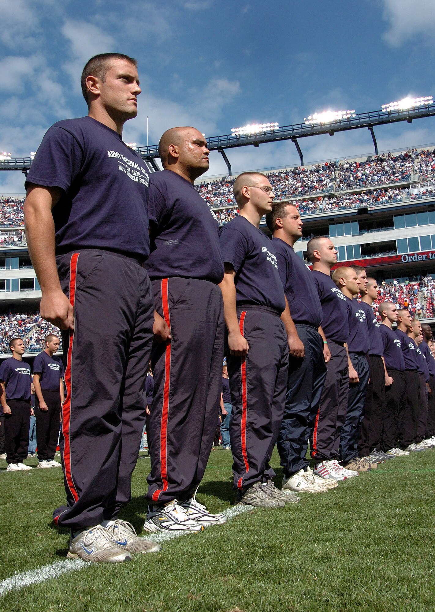 Hundreds line up during halftime of the New England Patriots and Buffalo Bills game to enlist in the Army National Guard. Brigadier General Oliver Mason gave the oath. Before the game, a B-2 Stealth Bomber from Whiteman Air Force Base, Mo., did a flyover that erupted the crowd. New England went on to win the game played at Gillette Stadium, 19-17. (U.S. Air Force photo by Tech. Sgt. Larry A. Simmons)