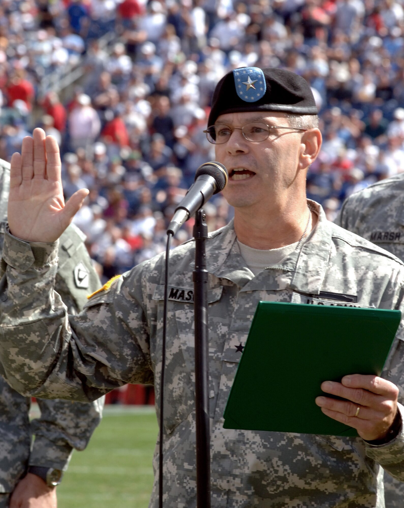 Brigadier General Oliver Mason enlists hundreds into the Army National Guard during halftime of the New England Patriots versus Buffalo Bills game at Gillette Stadium 10 Sep. Before the game, a B-2 Stealth Bomber from Whiteman Air Force Base, Mo., did a flyover that erupted the crowd. New England went on to win the game played at Gillette Stadium, 19-17. (U.S. Air Force photo/Tech. Sgt. Larry A. Simmons)
