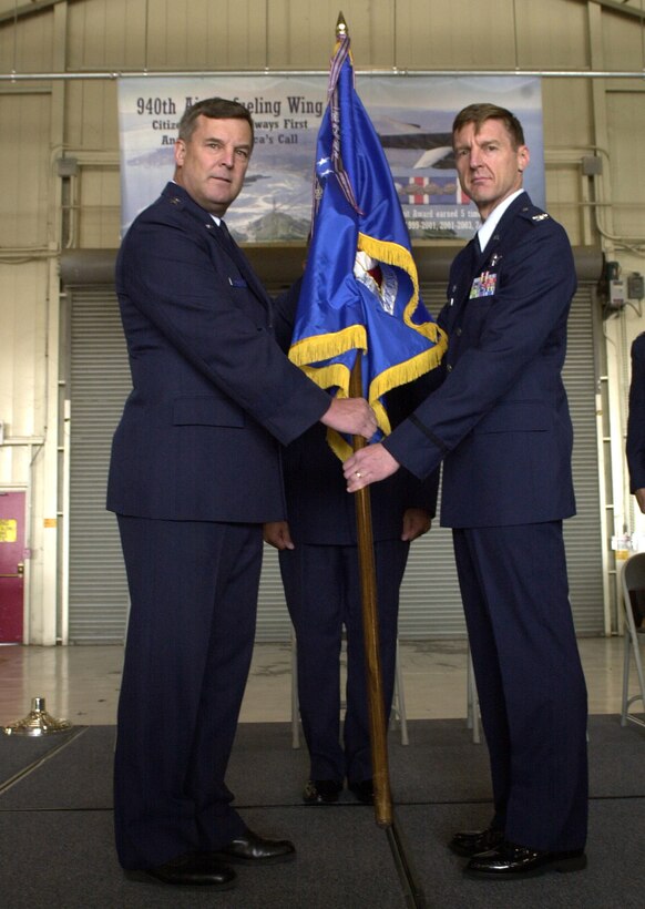Col. Albert Reif (right) accepts the unit flag and command of the Air Force Reserve's 940th Air Refueling Wing from Maj. Gen. Robert Duignan, 4th Air Force Commander, during a ceremony Sept. 9, 2006 at Beale Air Force Base, Calif.  Colonel Reif will lead the wing's Reservists during the next two years of a BRAC directed transition from flying the KC-135 Stratotanker to new missions.  (U.S. Air Force photo/Staff Sgt. Luke Johnson)                             