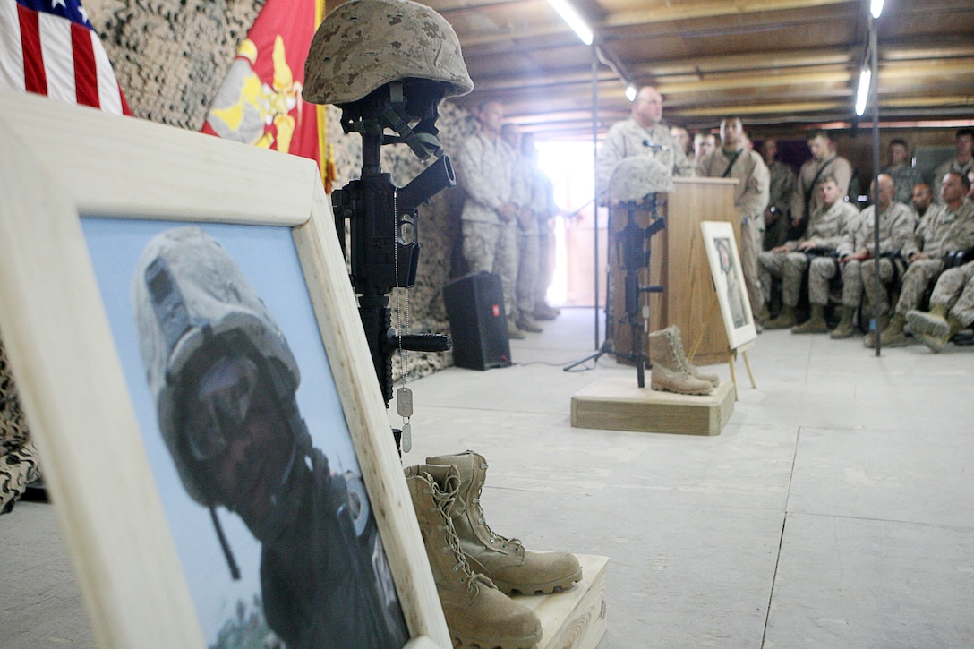 Monuments honoring Staff Sgt. Dwayne E. Williams, a team leader with 3rd Explosive Ordinance Platoon (EOD), 9th Engineer Support Battalion, 1st Marine Logistics Group (Fwd), and Sgt. John P. Phillips, a explosive ordinance technician with 3rd EOD platoon, set up during a memorial held at main side chapel here September. Williams, a Baltimore native, lost his life Aug. 24, 2006 from wounds sustained while engaged in operations in the Al Anbar Province. Phillips, a St. Stephen, S.C., native, died Aug. 16, 2006 at Brooke Army Medical Center, San Antonio, succumbing from wounds received March 7, 2006 while involved in operations in the Al Anbar Province. ?These men were both completely different, but they shared a similar trait, they were the embodiment of the quiet, hard-working professional,? said Ingbretsen, a Spokane, Wash., native.