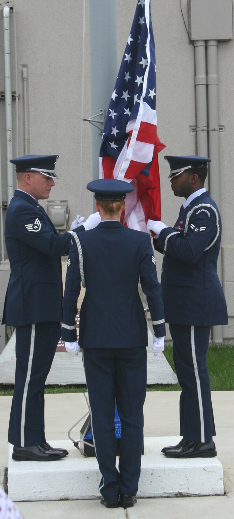 WRIGHT-PATTERSON AFB, Ohio -- The base Honor Guard raises the American flag during the 445th Airlift Wing's Patriot Day ceremony. (U.S. Air Force Photo by Maj. Ted Theopolos).