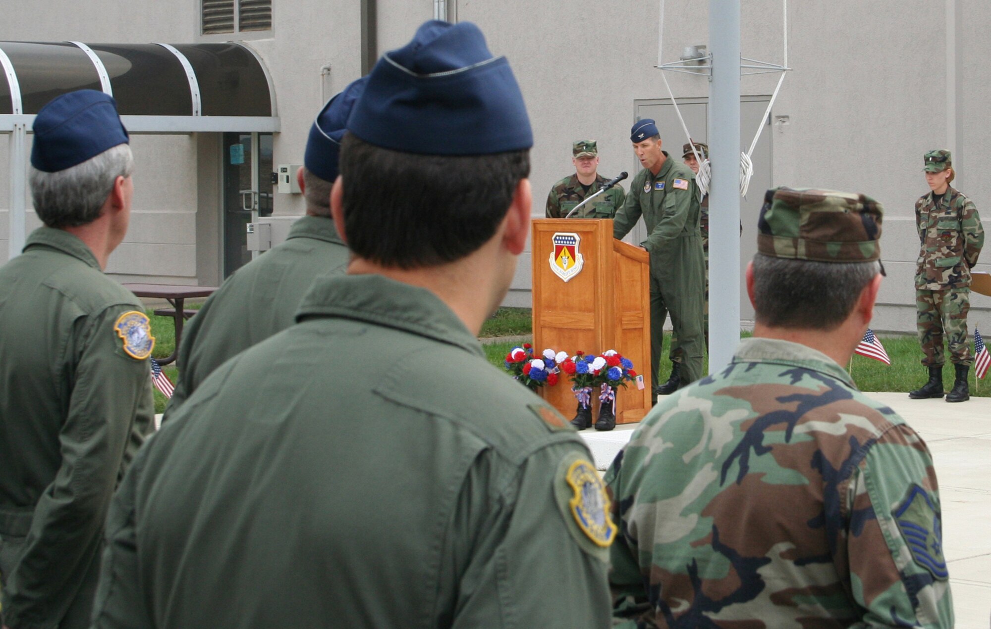 WRIGHT-PATTERSON AFB, Ohio -- Col. Brian Dominguez, 445th Airlift Wing vice commander, addresses military and civilians at a Patriot Day ceremony in front of the wing's headquarters. (U.S. Air Force photo by Maj. Ted Theopolos).