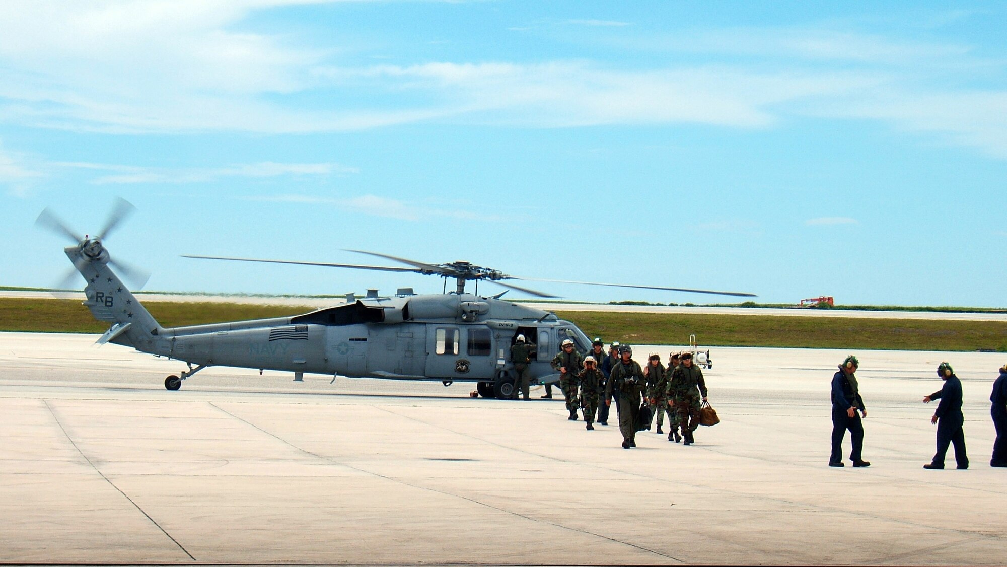 Members from the 36th Medical Group, 36th Wing and the U.S. Navy Helicopter Sea Combat Squadron 25 return to Andersen Air Force Base, Guam, Sept. 10 following a 72-day humanitarian and civic assistance deployment on the USNS Mercy. (U.S. Air Force photo)
