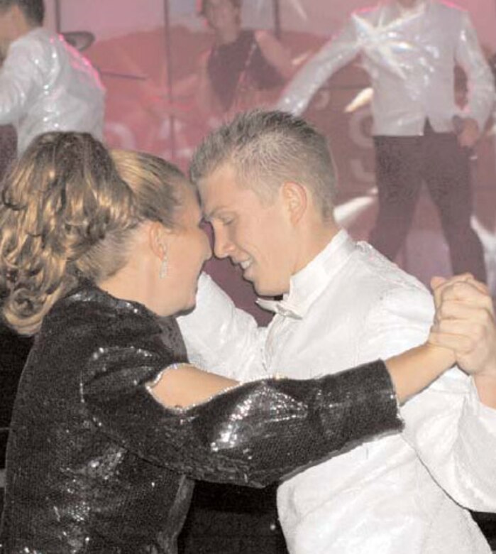 First Lt. Carolynn Czepiga and Airman 1st Class Bryce Zabric dance during the opening set of the Tops in Blue Show. (U.S Air Force Photo/Valerie Mullet)