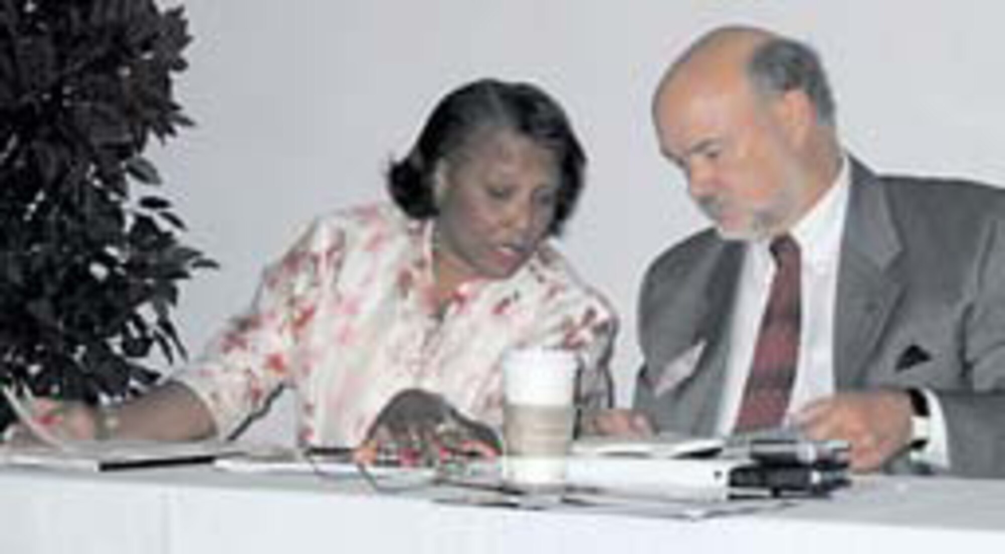 Mrs. Patricia Kirk-McAlpine, DCMA Space and Missile Systems Division director, and Mr. Lawrence Clark, acting director of Contracts, discuss the agenda for the day.