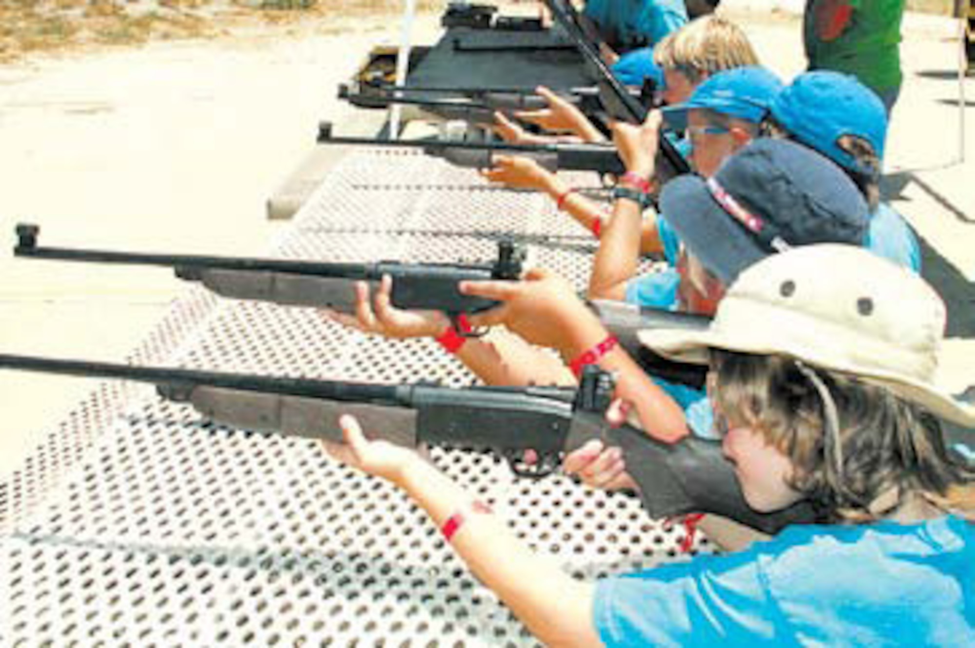 Webelo Scouts take aim at their targets as they prepare to qualify on how to safely use BB guns.