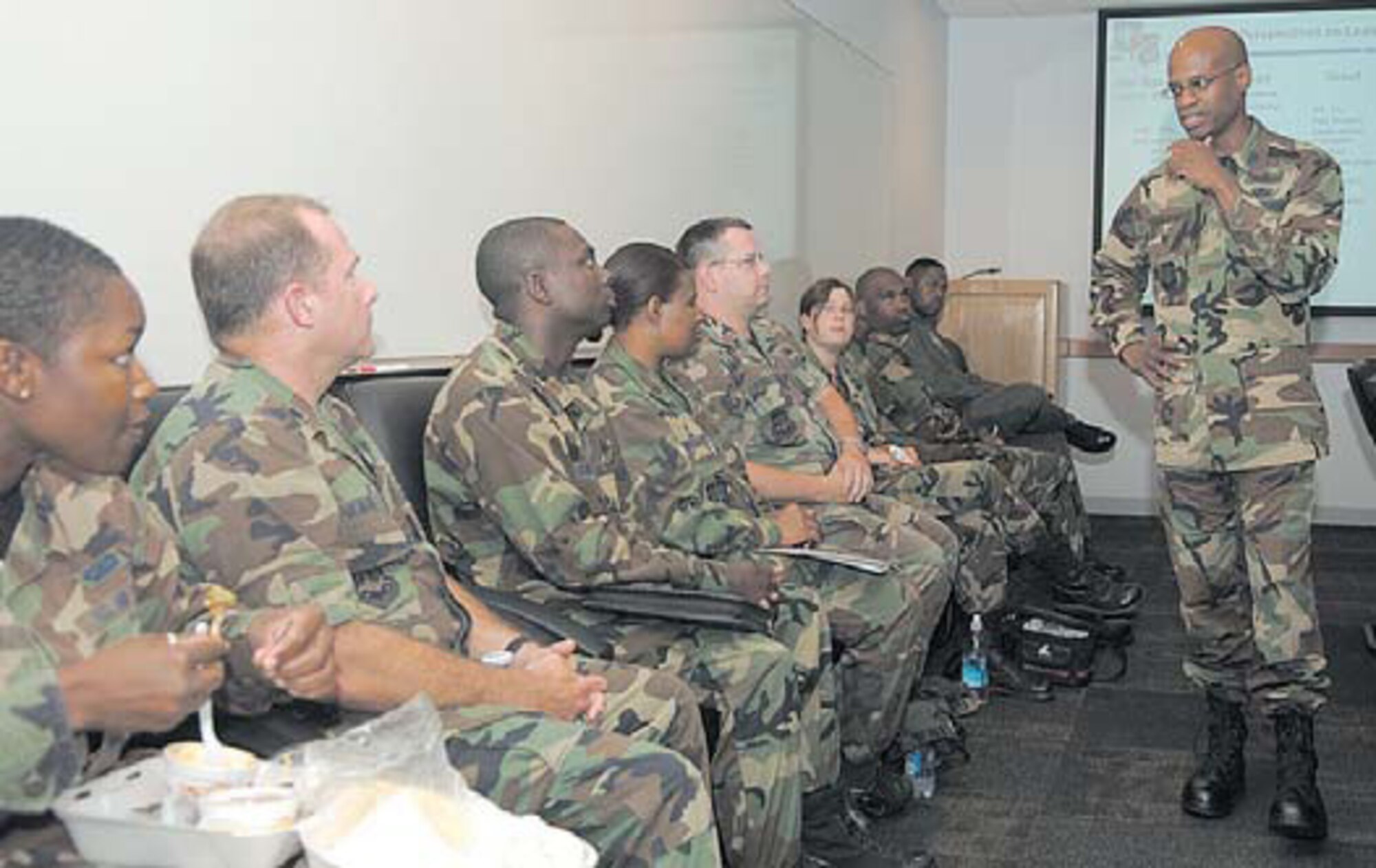 Colonel Ed Bolton, Launch and Range Systems Wing commander, discusses the Air Force Cadet Mentor Action Program to a group of SMC Company Grade Officers during a brown-bag briefing here, July 20.