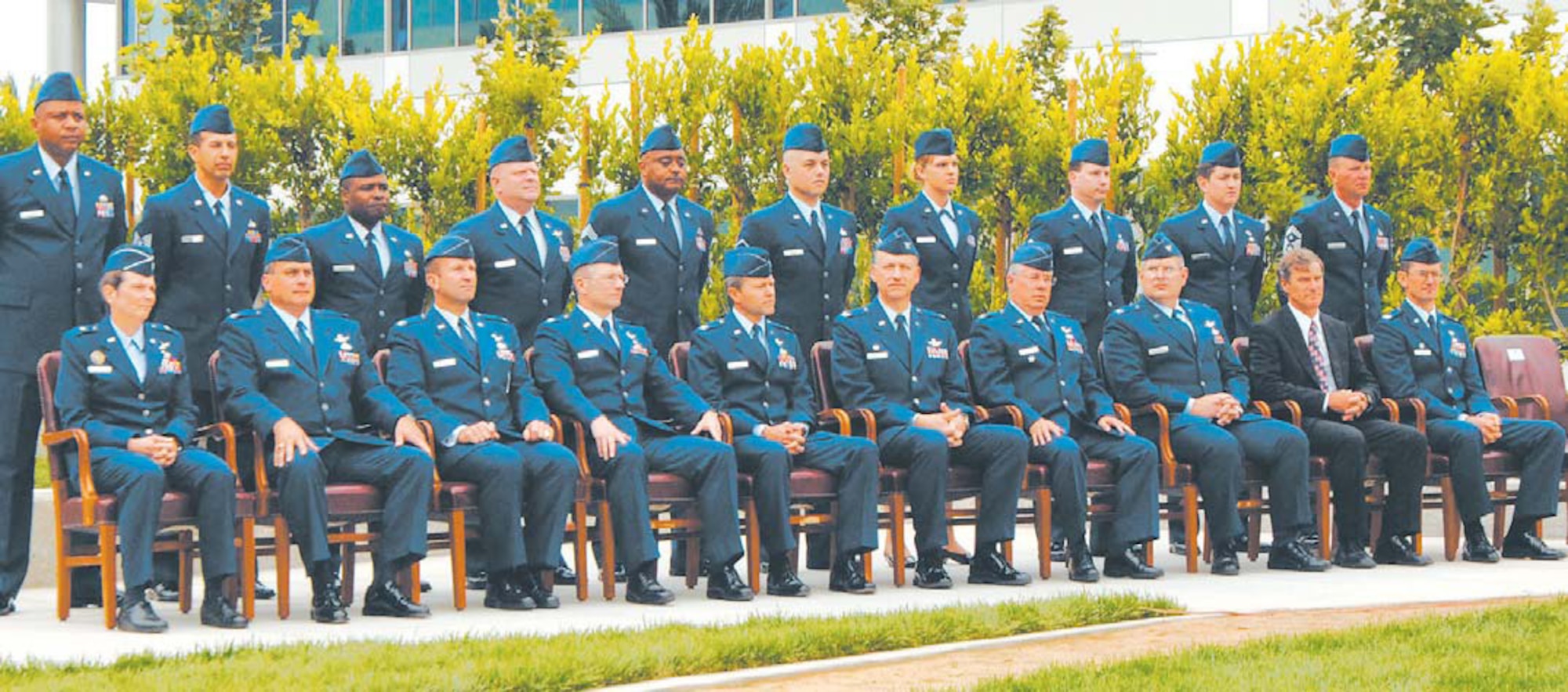 The new wing and group commanders assemble at the Schriever Space Complex courtyard during the Wing activation ceremony. They are (front row, left to right); Brig. Gen. Ellen Pawlikowski, Military Satellite Communications Systems Wing commander; Col. David O?Brian, representing Brig. Gen. (s) Edward Bolton, Launch and Range Systems Wing commander; Col. Allan Ballenger, Global Positioning Systems Wing commander; Col. Randall Weidenheimer, Space Based Infrared Systems Wing commander; Col. Michael Taylor, Space Superiority Systems Wing commander; Col. Richard White, Space Development and Test Wing commander; Col. John Wagner, Defense Meteorological Satellite Program Systems Group commander; Col. Michael Coolidge, Satellite Control and Network Systems Group commander; Mr. Lou Johnson, Space Logistics Group director; and Col. Joseph Schwarz, 61st Air Base Wing commander. Their Senior NCOs stand solidly behind them.