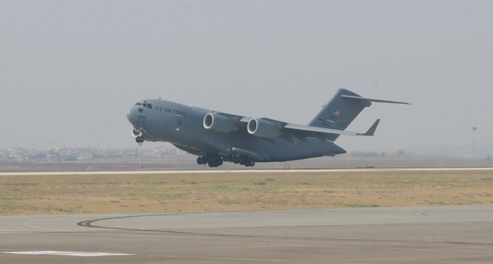 INCIRLIK AIR BASE, Turkey -- A C-17 Globemaster III takes off from Incirlik Air Base, Turkey in remembrance of Sept. 11, on Sept 11. The C-17 took flight at 3:46 p.m., EEST (Turkey time), to commemorate when Flight 11 hit the North Tower of the World Trade Center at 8:46 a.m. EDT  (U.S. Air Force photo by Airman First Class Tiffany A. Colburn).                              