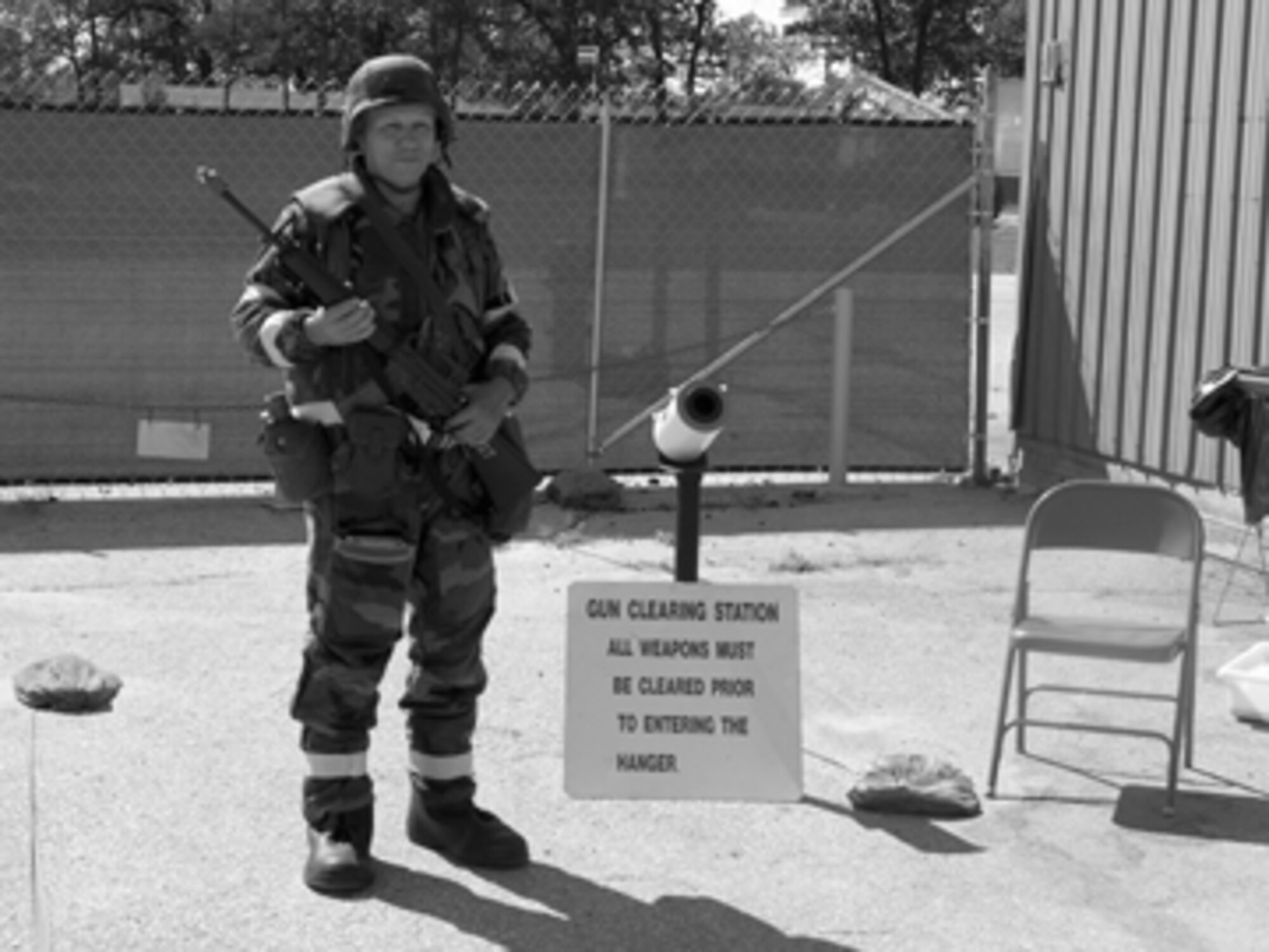 A member of the 612th Air Expeditionary Wing works at the gun clearing station