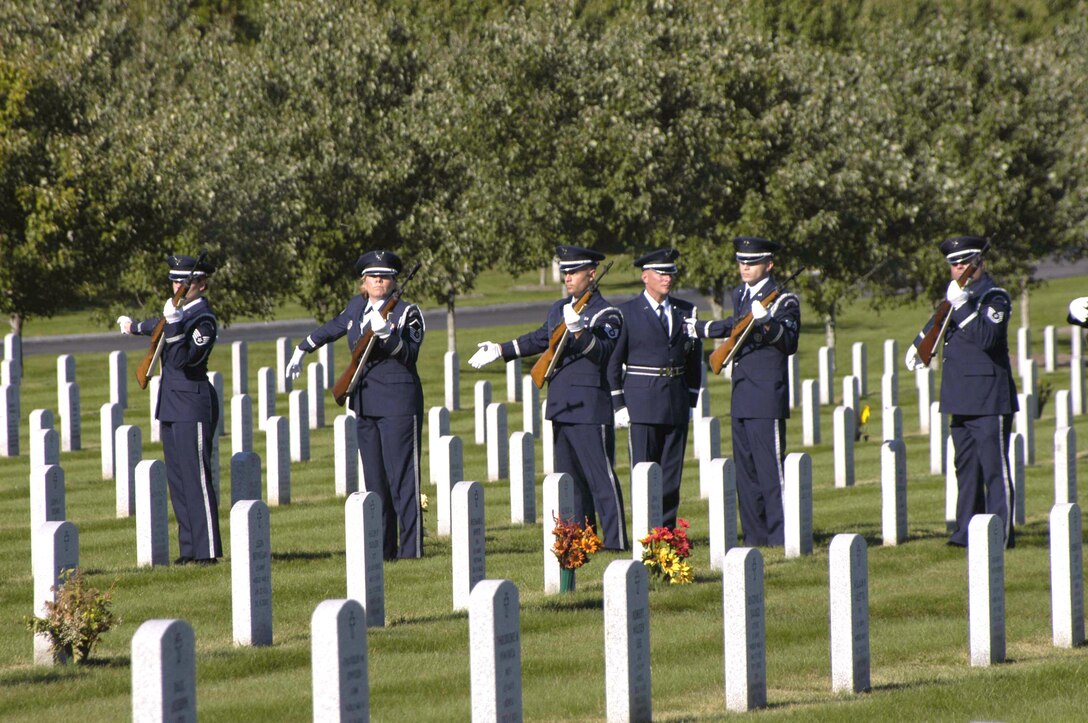 Airmen from the New York Air National Guard's 109th Airlift Wing Honor Guard perform a rifle salute during the funeral for Master Sgt. Joseph Longobardo Sept. 11.  Sergeant Longobardo, a guardsman with the 109th Security Forces Squadron, was a New York State Police officer who was killed in the line of duty Sept. 3 while participating in the manhunt for fugitive Ralph "Bucky" Williams.  More than 100 Airmen from the 109th AW attended his funeral. (U.S. Air Force photo/Master Sgt. Willie Gizara) 