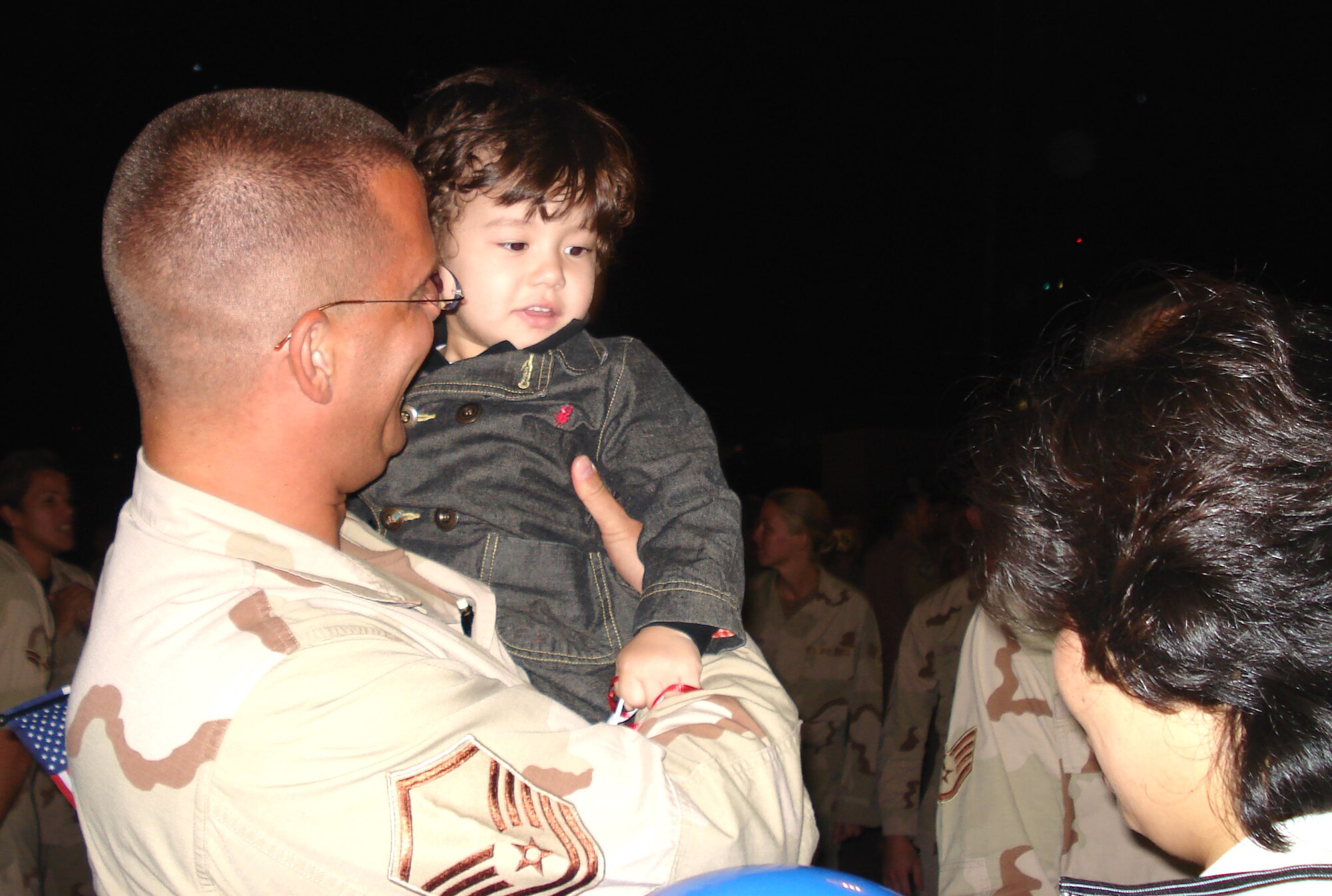 Master Sgt. Donald Villars greets his wife, Yong, and son, Daniel, upon his return to Spangdahlem Air Base, Germany, Sept. 9 from a deployment to Southwest Asia. He is assigned to the 52nd Aircraft Maintenance Squadron. (U.S. Air Force photo/Capt. Diane Weed)
