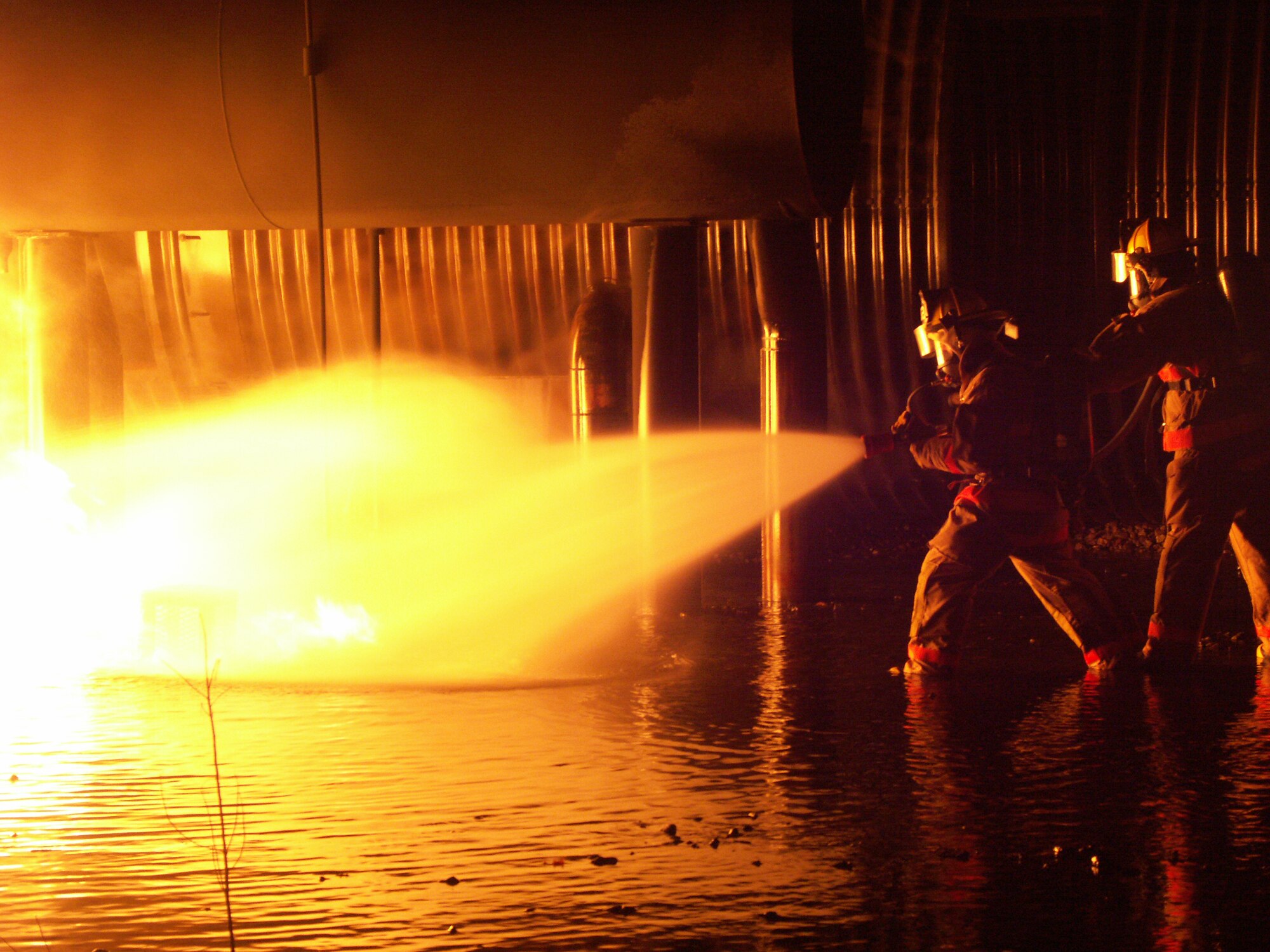 932nd Airlift Wing firefighters move in on a "simulated" fire at Scott Air Force Base.  They practice throughout the year to stay in top form.  Interested in becoming a firefighter?  Call a recruiter at 1-800-257-1212.