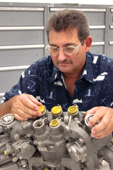 William Durham used an inexpensive steam cleaner to discover a $36 solution the Air Force now uses. It saves $10,000 augmenter fuel controllers from the condemned pile. Mr. Durham is a mechanic with the 76th Maintenance Wing at Tinker Air Force Base, Okla. (U.S. Air Force photo/Margo Wright) 