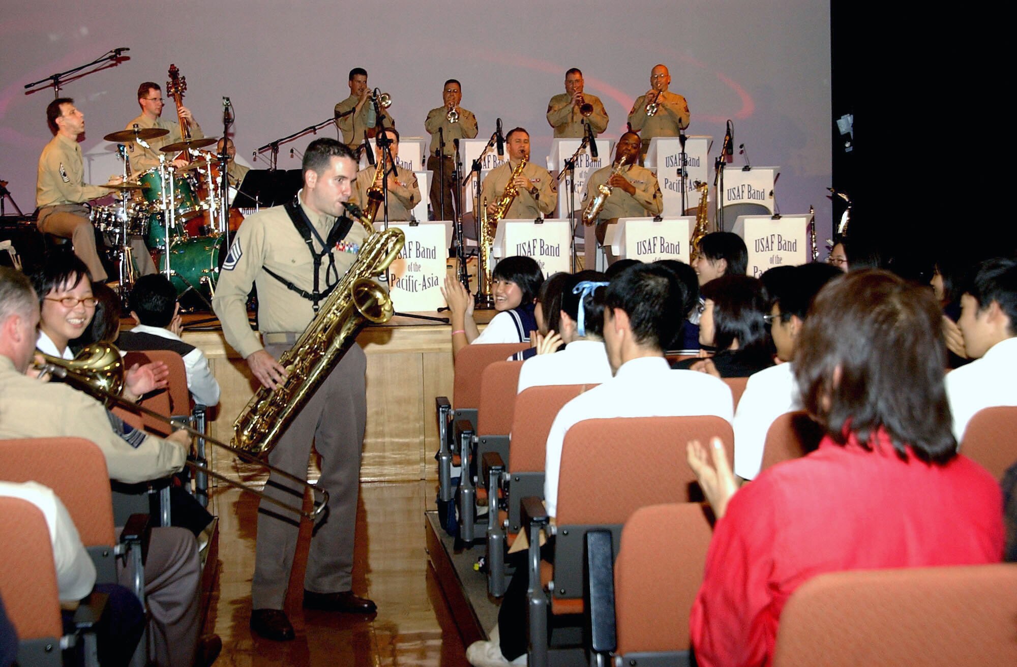 Staff Sgt. Joe Wagner interacts with the audience during a concert in Tsugaru-City, Japan, Sept. 9. The band played more than 20 swing and contemporary jazz pieces before a capacity crowd. The Pacific Showcase band is stationed at Yokota Air Base, Japan, and plays throughout the region at military and civilian events. (U.S. Air Force photo/Staff Sgt. A.C. Eggman)