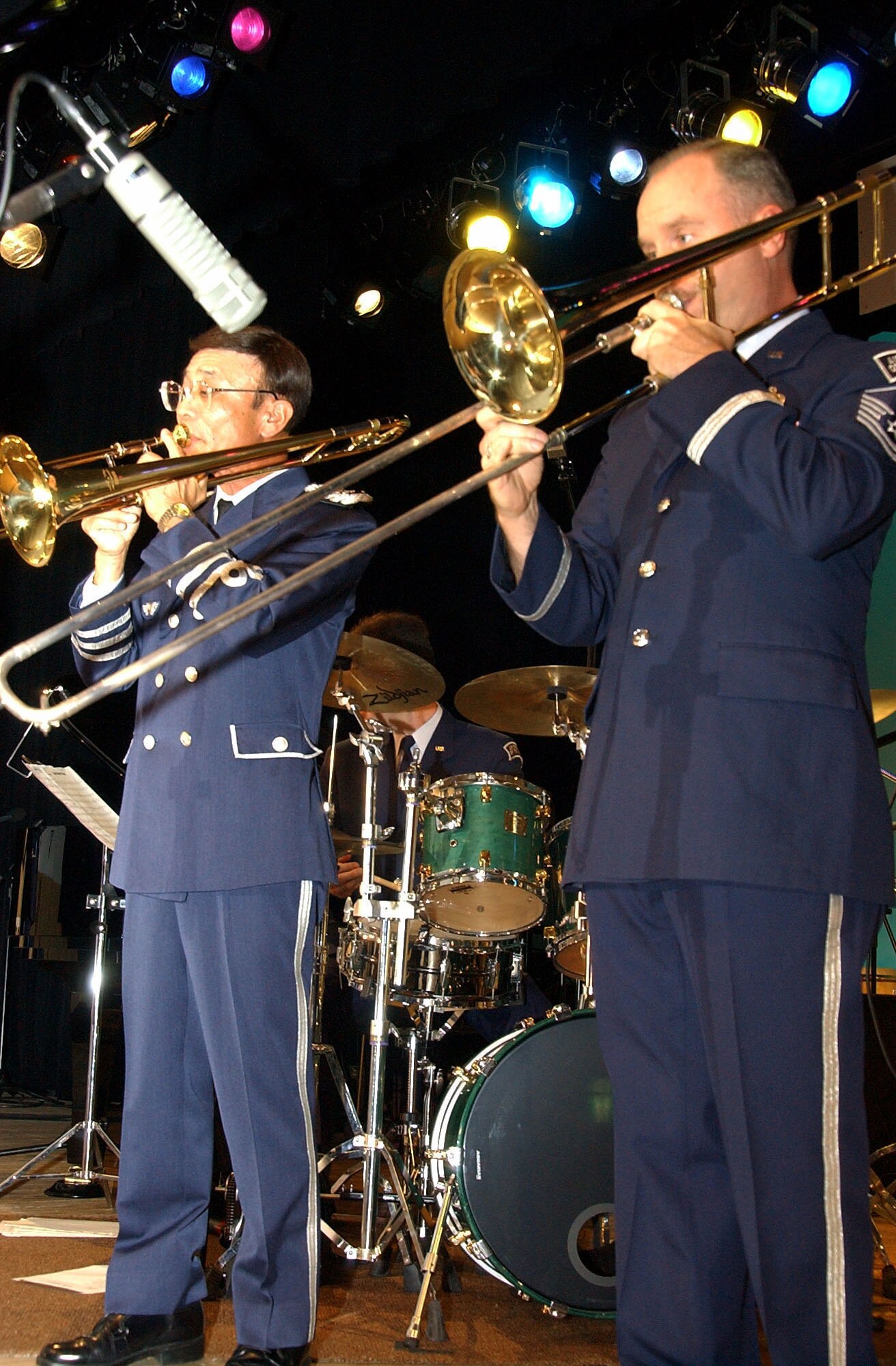 Japan Air Self-Defense Force Capt. Shuntaro Narita and Master Sgt. Tom Eckert perform a trombone duet at a performance in Tsugaru-City, Japan, Sept. 9. The captain and two other members of the JASDF's Northern Air Defense Force band joined Sergeant Eckert and 16 other members of Pacific Showcase, the U.S. Air Force Band of the Pacific-Asia, in entertaining the capacity crowd. The U.S. band is stationed at Yokota Air Base, Japan. (U.S. Air Force photo/Staff Sgt. A.C. Eggman) 