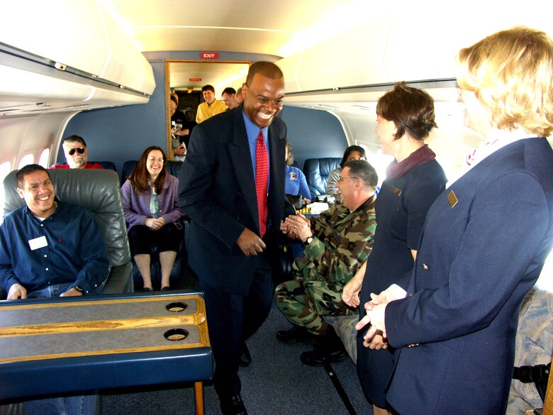 Bosses of 932nd Airlift Wing reservists enjoy a laugh during their employer flight on board a C-9C during Boss Day.  The flight attendants took care of the employers by serving meals.  Are you interested in becoming an Air Force Reserve Command flight attendant, pilot or maintainer?  Call 1-800-257-1212 for more information.  