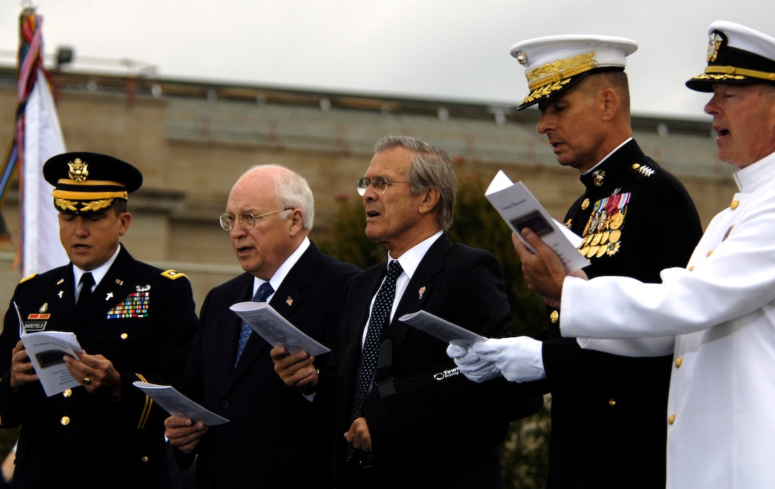 From left, U.S. Army Chaplain Lt. Col. William O. Barefield, Vice President Dick Cheney, Defense Secretary Donald H. Rumsfeld, Chairman of the Joint Chiefs of Staff U.S. Marine Corps Gen. Peter Pace and U.S. Navy Chaplain Capt. Jonathan Frusti sing a patriotic song during a five-year observance ceremony at the Pentagon, Sept. 11, 2006.    