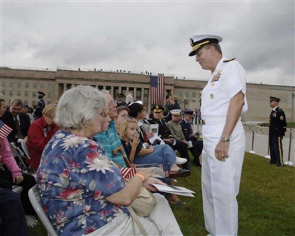 Vice Chairman of the Joint Chiefs of Staff Adm. Edmund Giambastiani, U.S. Navy, speaks with family members of victims of the Sept. 11, 2001, terrorist attack on the Pentagon during the flyover observance on Sept 11, 2006.  The Pentagon observance included speeches by Vice President Dick Cheney, Secretary of Defense Donald H. Rumsfeld and Chairman of the Joint Chiefs of Staff Gen. Peter Pace, U.S. Marine Corps.    