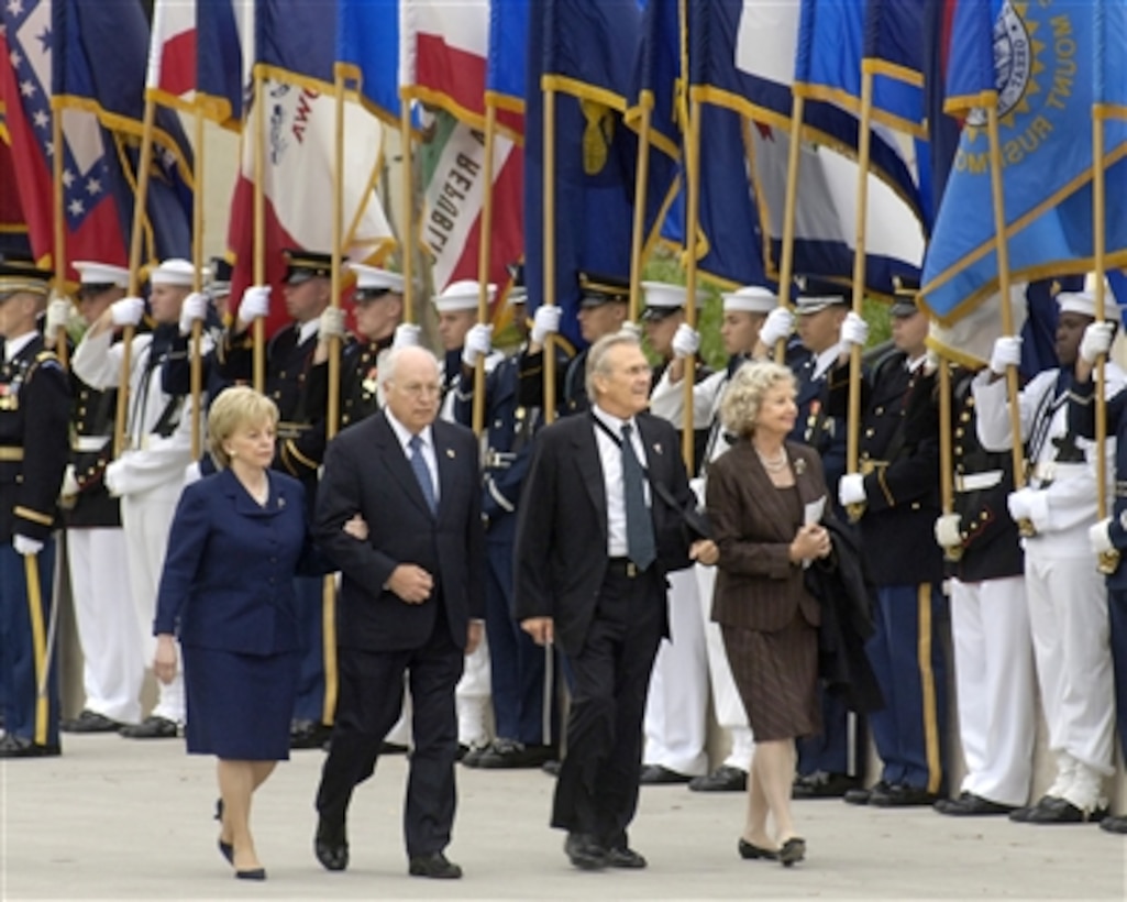 Vice President and Mrs. Dick Cheney (left) and Secretary of Defense and Mrs. Donald H. Rumsfeld (right) arrive at the Pentagon Mall Entrance on Sept. 11, 2006, for ceremonies marking the 5th anniversary of the terrorist attack on the Pentagon.  One hundred eighty-four people died at the Pentagon on Sept. 11, 2001, when a group of terrorists hijacked American Airlines Flt. 77 and crashed it into the western face of the building.  