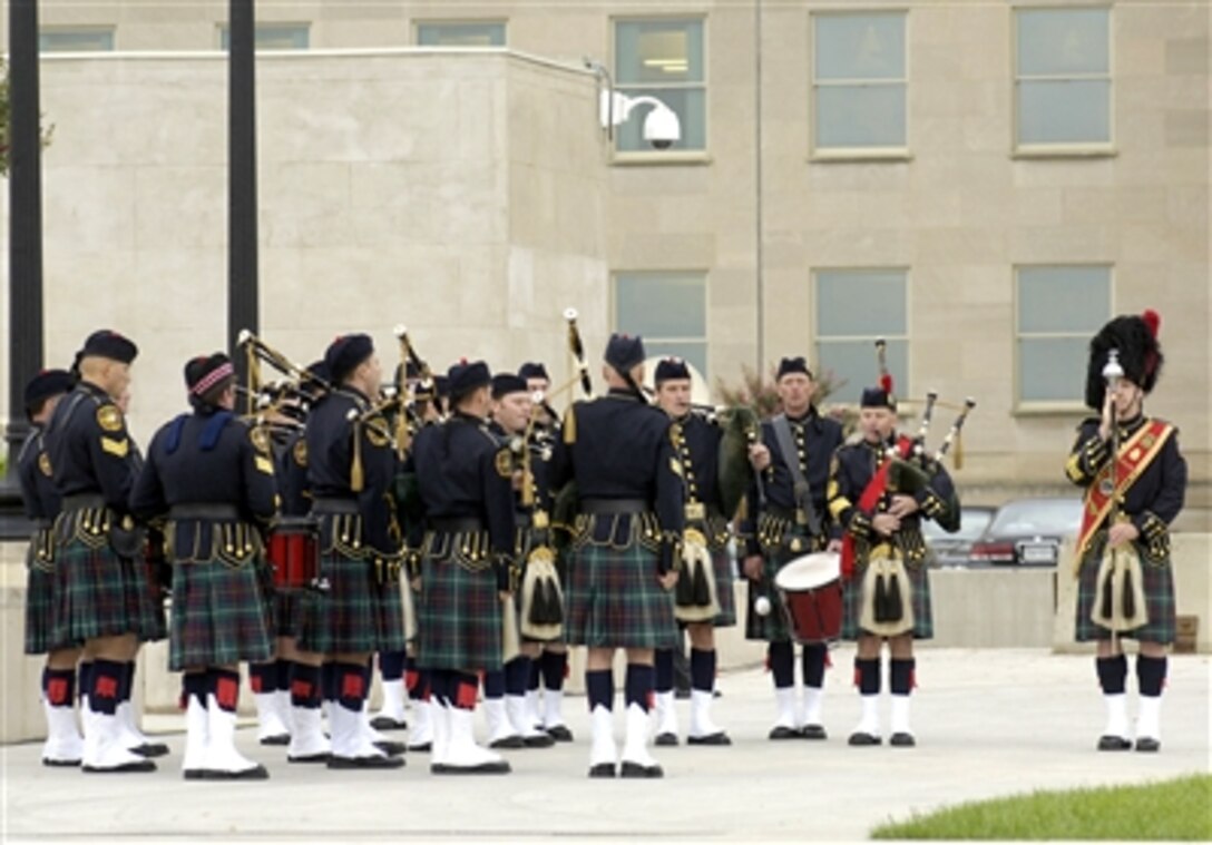 The pipes and drums of the District of Columbia Fire Department perform Amazing Grace during observances at the Pentagon marking the 5th anniversary of the Sept. 11, 2001, terrorist attack on the building.  Vice President Dick Cheney, Secretary of Defense Donald H. Rumsfeld and Chairman of the Joint Chiefs of Staff Marine Corps Gen. Peter Pace addressed the audience of family members of those killed in the attack and Pentagon employees.  