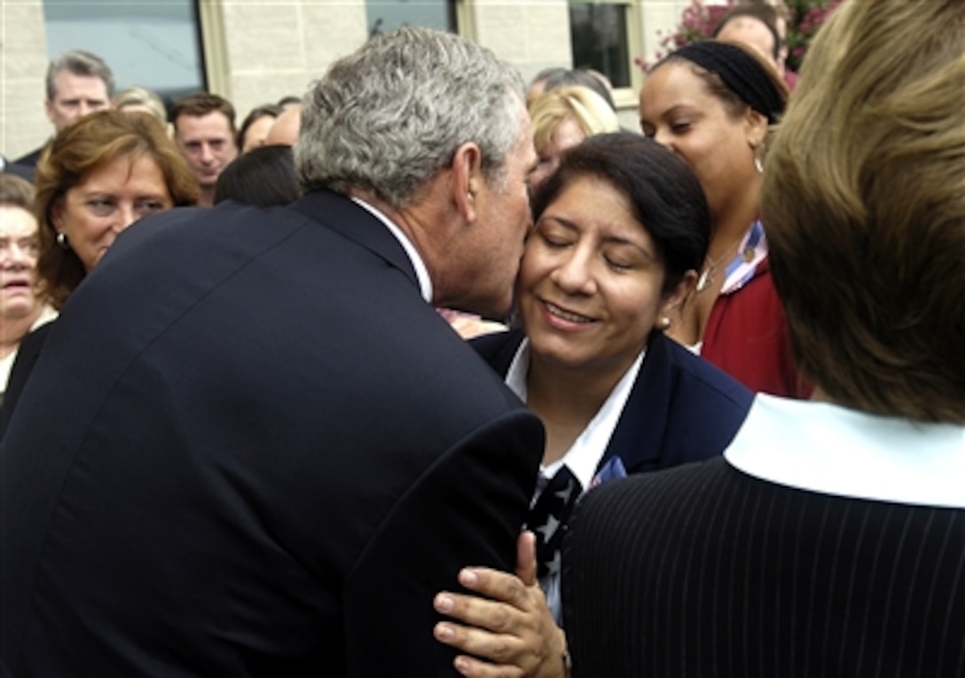 President George W. Bush meets with family members of those who lost their lives at the Pentagon on 9/11, during a wreath laying ceremony at the crash site of Flight 77 at the Pentagon, Sept. 11, 2006.  