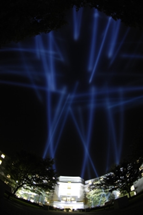 One hundred eighty-four beams of light are illuminated at the Pentagon during the Washington, D.C. Freedom Walk, Sept. 10, 2006. The lights commemorate each life lost at the Pentagon on Sept. 11, 2001.   