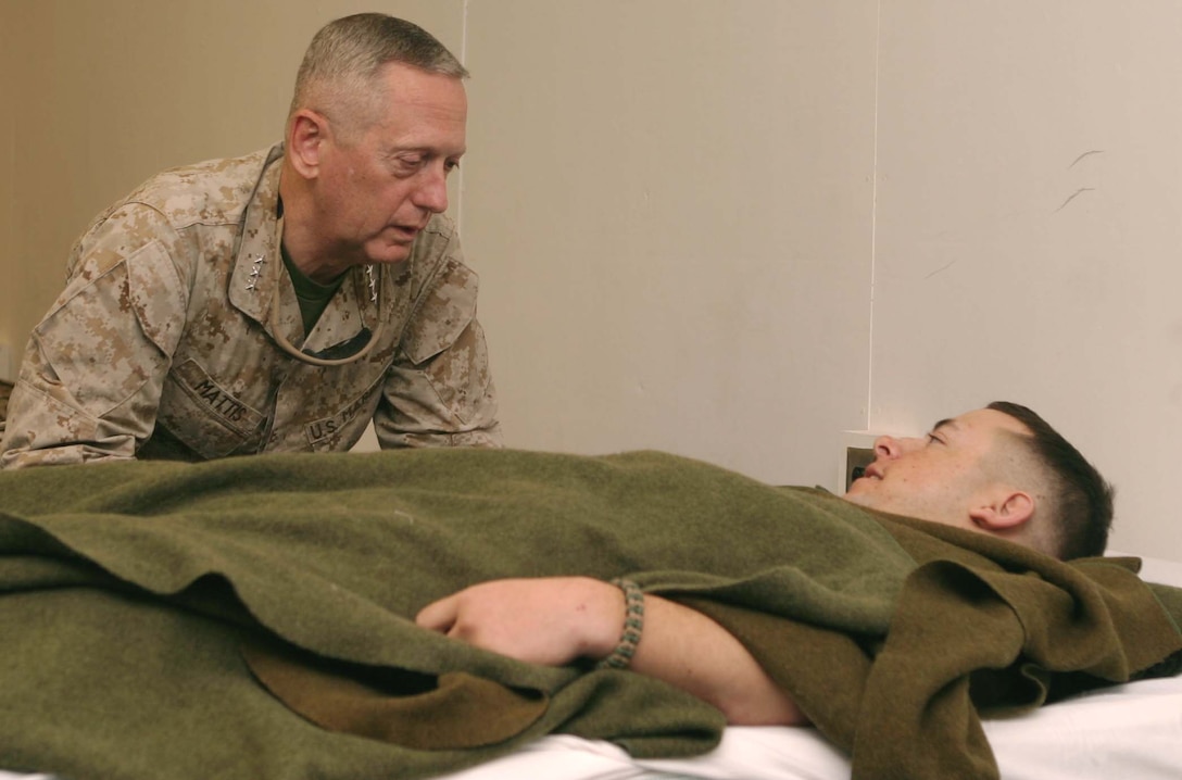 Lieutenant Gen. James N. Mattis, Commanding General, U.S. Marine Forces Central Command and I Marine Expeditionary Force, visits with a Marine at Camp Taqaddum?s Shock and Surgical Trauma Platoon facility. Mattis recently toured several locations throughout Iraq, his first trip to the country since assuming command of I MEF in August. After visiting the medical facility, Mattis ate lunch with a small group of Marines and sailors. ?It?s definitely been the highlight of this deployment,? said Navy Petty Officer 3rd Class Luis E. Sanchezcarranza, a hospital corpsman augmented to 2nd Explosive Ordnance Disposal (EOD) Platoon, 1st EOD Company, 1st Marine Logistics Group (Fwd). ?I can?t really put into words how honored I feel right now.?