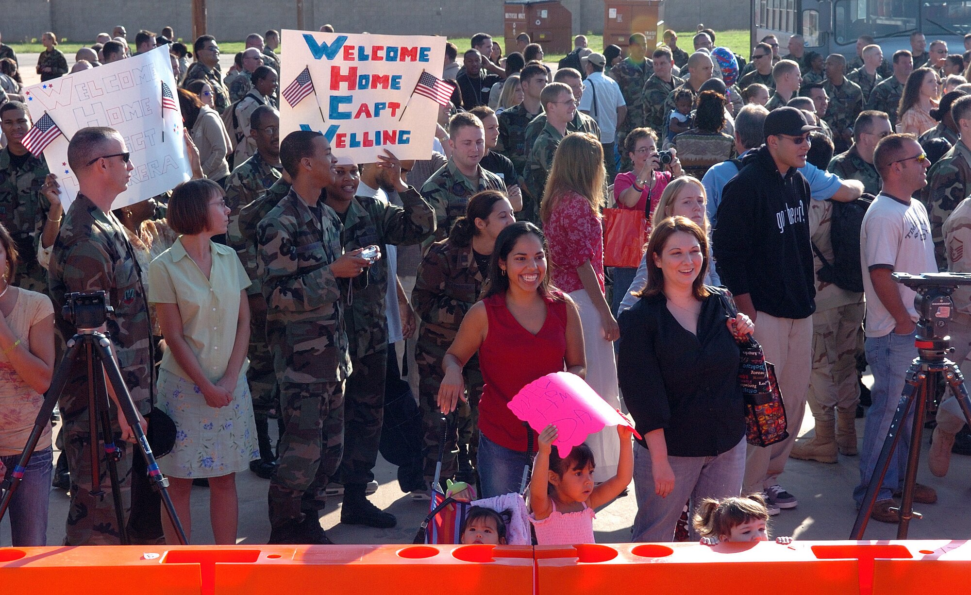 Family and friends anxiously await the return of Airmen to Dyess Air Force Base, Texas, on Sept. 13, who deployed in support of operations Enduring Freedom and Iraqi Freedom. (U.S. Air Force photo/Tech. Sgt. Larry A. Simmons)