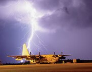 Lightning strikes near an MC-130E Combat Talon on Duke Field's flight line. When "lightning within five" is announced, wing members are instructed to seek immediate shelter. Personnel should also shut down their computers and unplug them unless they are protected by an uninterrupted power supply.               