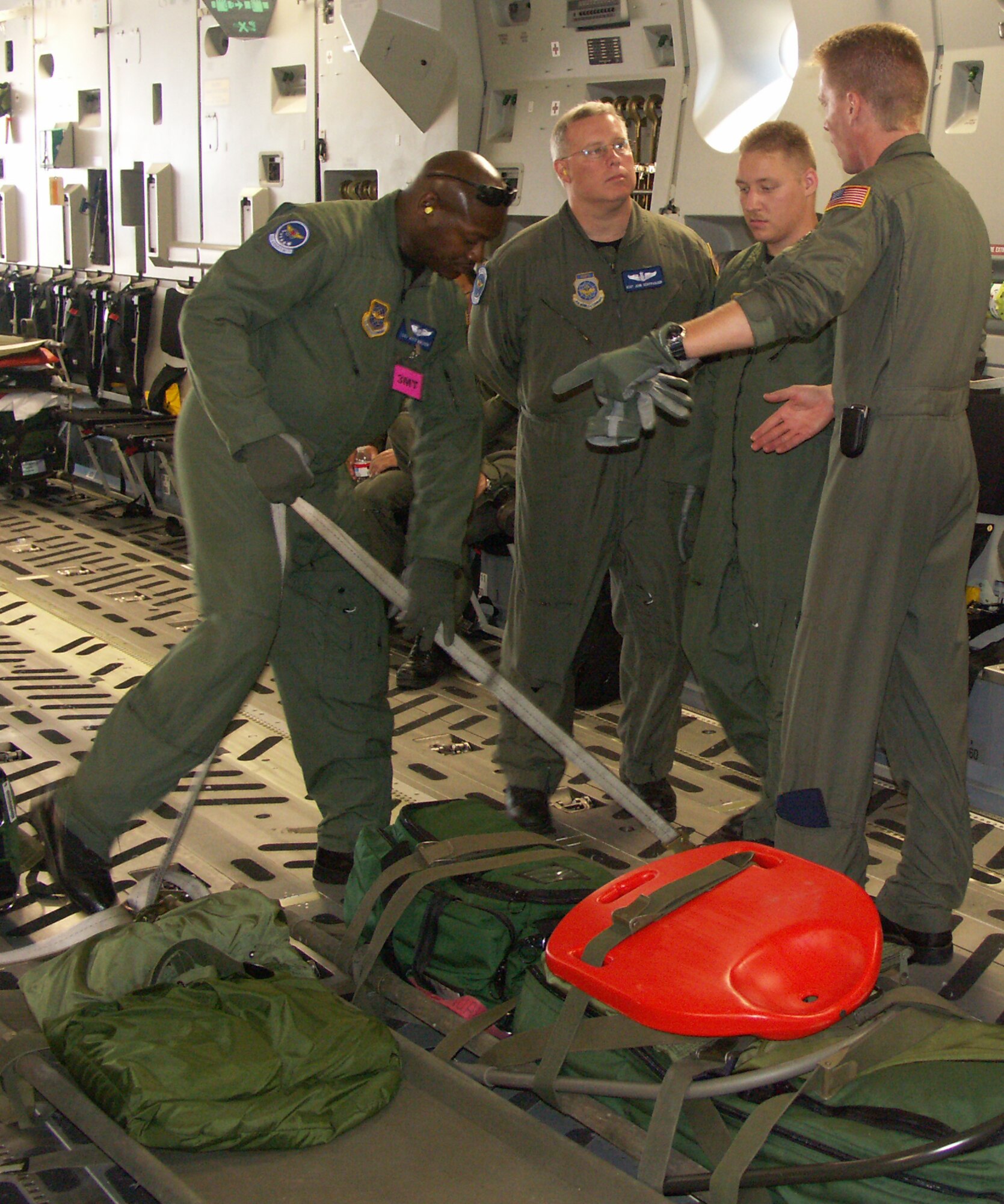 Members of the 932nd Aeromedical Evacuation Squadron prepare equipment for a morning departure of a C-17. Photo by TSgt. Gerald Sonnenberg