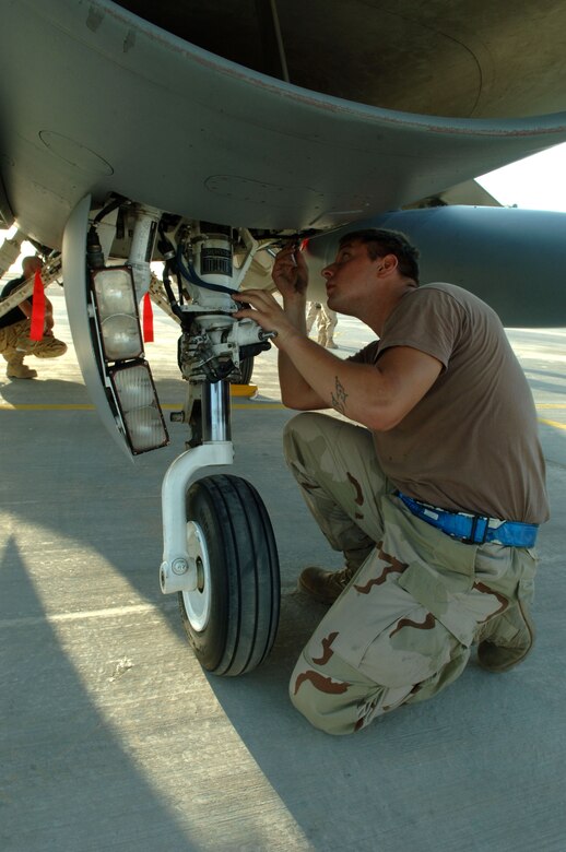 Senior Airman Airman Bradley Schuster performs post-flight maintenance on an F-16 Fighting Falcon at Balad Air Base, Iraq, Sept. 9. Airman Schuster is deployed from Cannon Air Force Base, N.M., and is assigned to the 332nd Expeditionary Aircraft Maintenance Squadron. (U.S. Air Force photo/Airman 1st Class Chad M. Kellum)