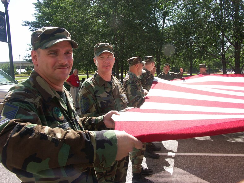 932nd Airlift Wing members smile as the community parade begins in Illinois.  Interested in the Reserve? Call 1-800-257-1212.
