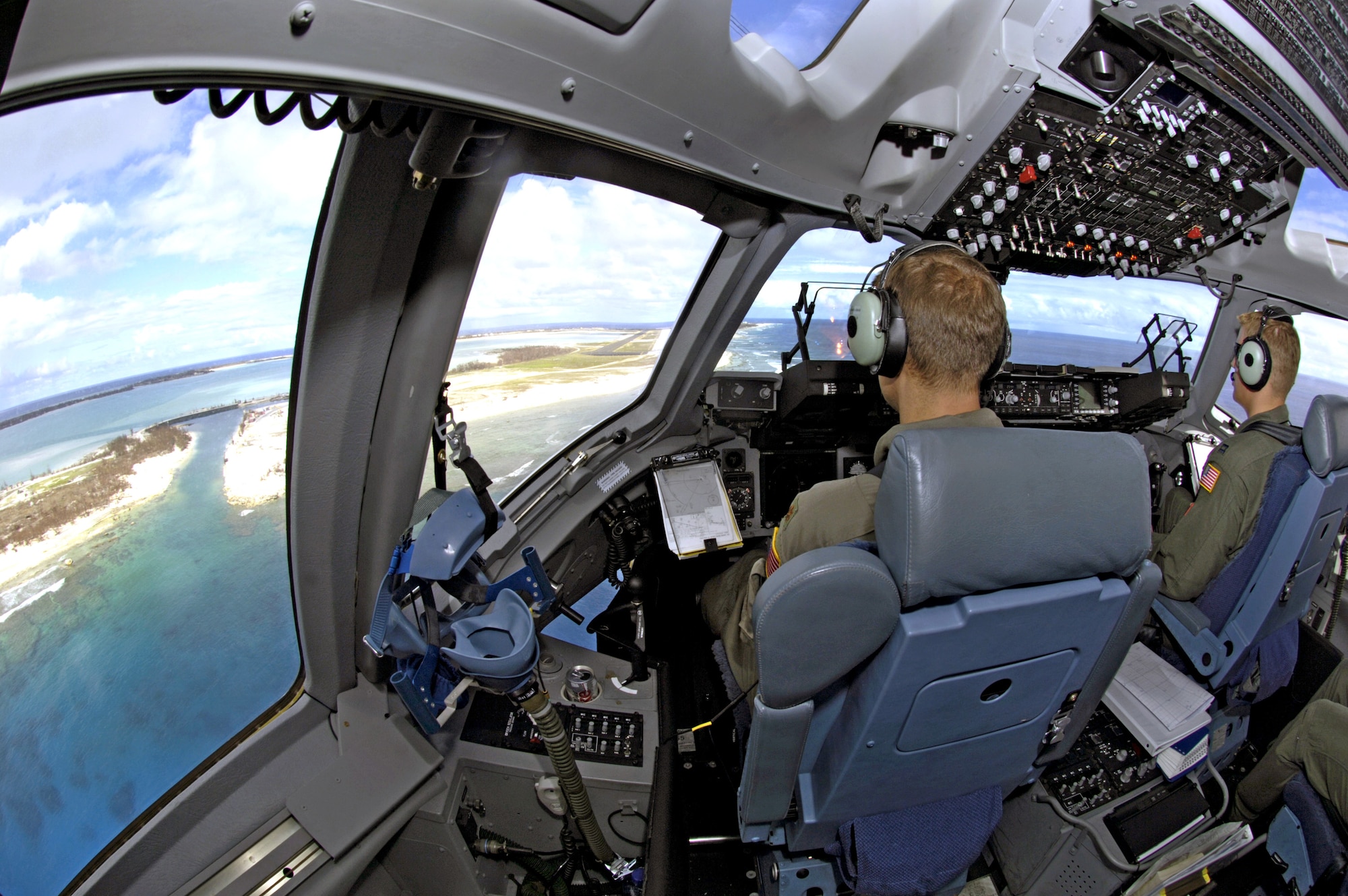 Maj. Joseph Golovach and Capt. John Ramsey III bring their C-17 Globemaster III in for a landing on Wake Island Sept. 12. The C-17 brought a 53-person team to assess damage left by Super Typhoon Ioke after it struck the island Aug. 31. Both pilots are from the 535th Airlift Squadron at Hickam Air Force Base, Hawaii. (U.S. Air Force photo/Tech. Sgt. Shane A. Cuomo)