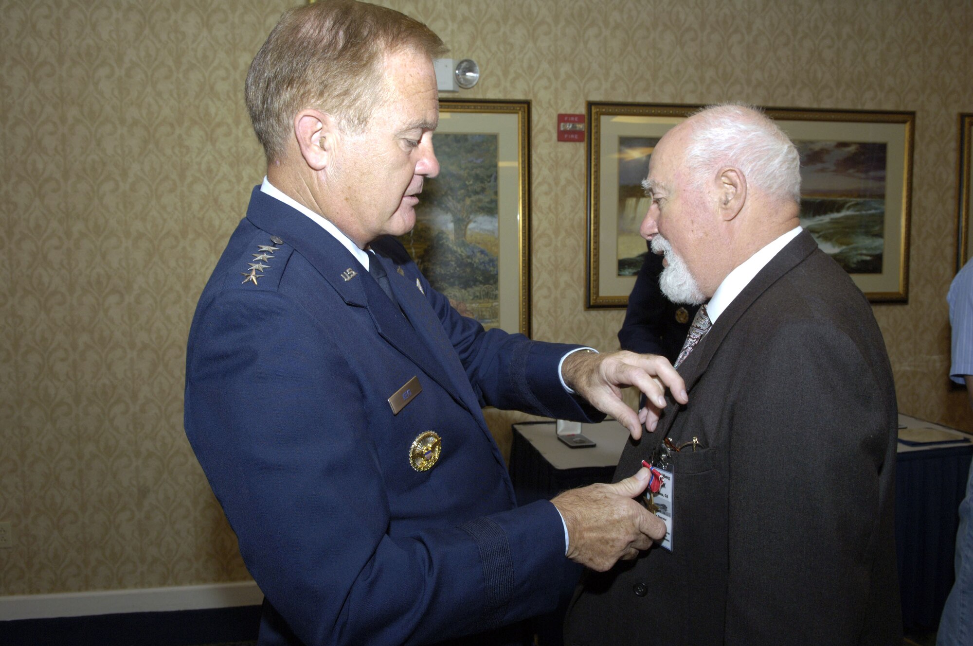 Gen. Ronald E. Keys presents Francis Goldberg a Bronze Star at a ceremony in Washington, D.C., Sept. 9. Five Bronze Stars were presented to World War II veterans. The paperwork for the medals had been misfiled and rediscovered more than 60 years later. The men were unaware they were supposed to receive the medals. General Keys is commander of Air Combat Command. (U.S. Air Force photo/Tech. Sgt. Cohen A. Young)
